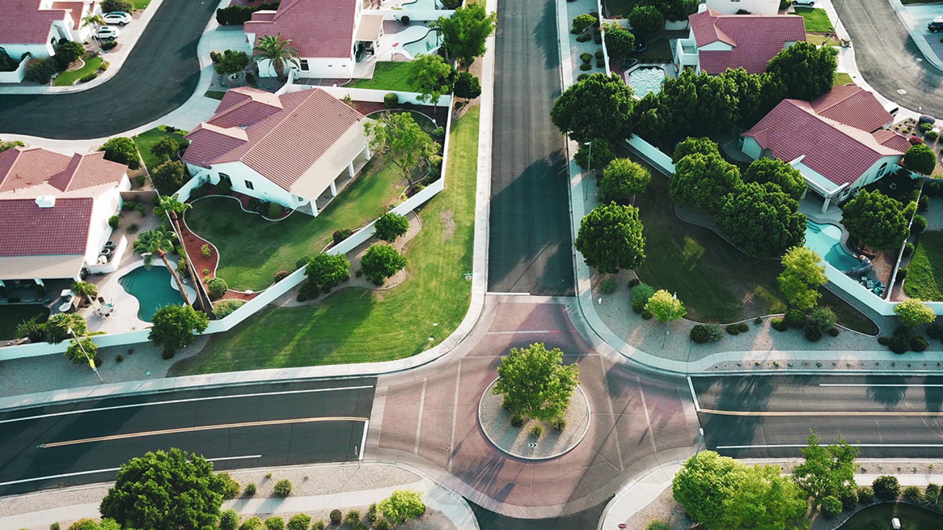Aerial view of HOA community with well-maintained roofs